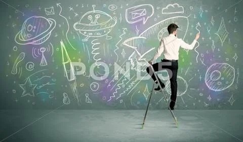 Young businessman drawing rocket Stock Photos