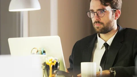 Young Businessman Drinking Tea During Work Stock Footage 70925370