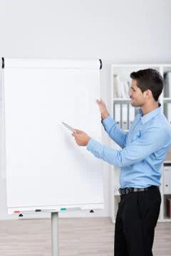 Young businessman explaining a flipchart Stock Photos