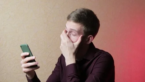 Young businessman feeling tired using smartphone having headache and pain in the Stock Footage 146740361