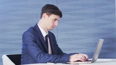 Young Businessman Focused on Work Stock Footage 69210764
