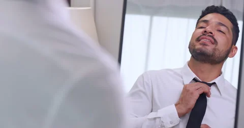  young businessman gets dressed in front of the mirror before going to work. Stock Footage 270505372