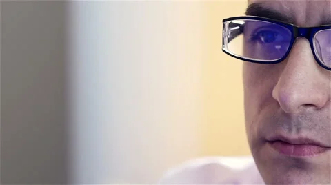 Young businessman with glasses working on computer Stock Footage 61342040