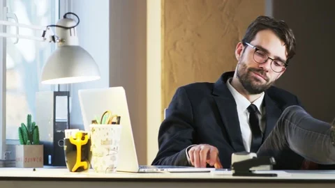 Young Businessman Happy While Talking on the Phone Stock Footage 70917249