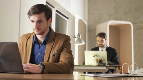 Young Businessman Having a Headache During Work Stock Footage 70918852