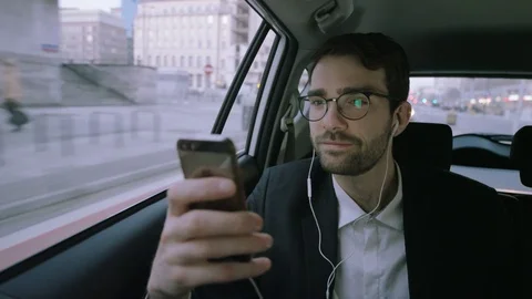 Young Businessman Looking Around During a Phone Call Stock Footage 73779678