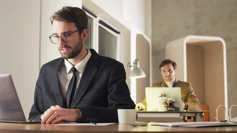 Young Businessman Looking With Attention at a Screen Stock Footage 70922583