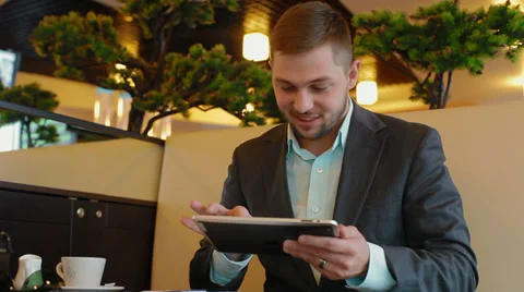 Young businessman looking at the camera and smiling Stock Footage 30351467