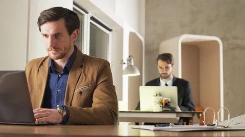 Young Businessman Looking With Interest at a Screen Stock Footage 70919862
