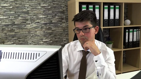 Young businessman in the office Stockbeeldmateriaal 116014688