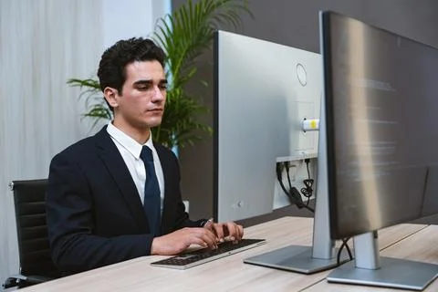 Young Businessman or Programmer looking worried and stressed over working o.. Stock Photos