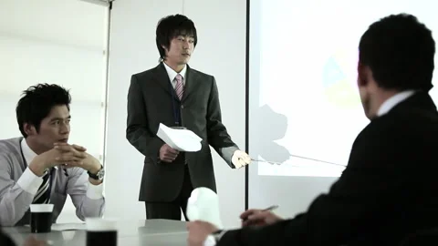 Young Businessman Presenting with a Projector Video stock 327585367