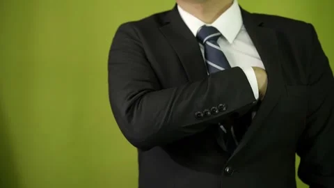 A young businessman pulls out $100 U.S. dollar bills, counts the wad of bills Stock Footage 275350894