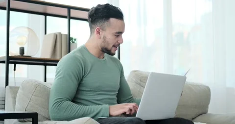 Young businessman reading document while doing video conference on laptop 스톡 동영상 156521386