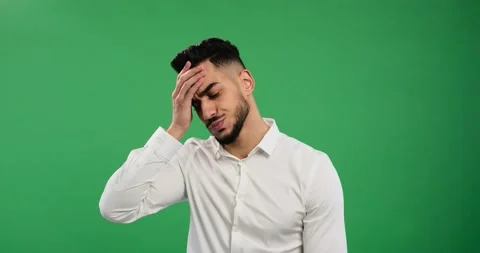 Young businessman regretting wrongdoing over green Stock Footage 168255238