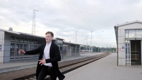 Young businessman rushing and missing train, late to work. Train station  Stock Footage 90524972