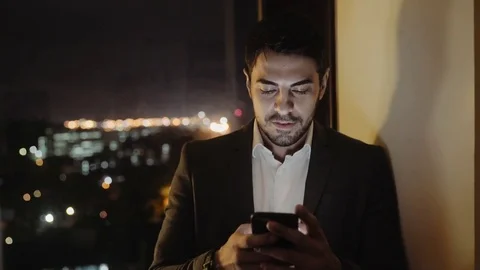 Young Businessman Smiles While Using Mobile App Stock Footage 83635667