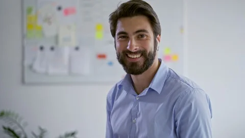 Young businessman smiling at camera while in office Stock Footage 109351768