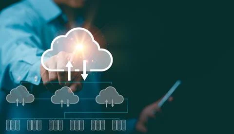 A young businessman stores important data through the cloud. Stock Photos