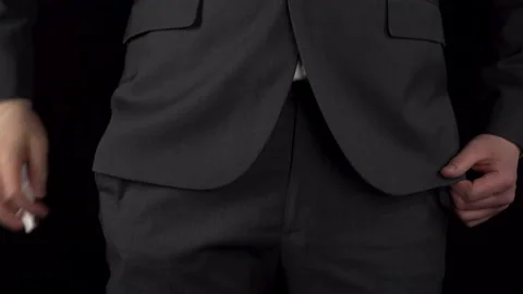 A young businessman in a suit pulls out a nasal spray from his pocket and sprays Stock Footage 171215920