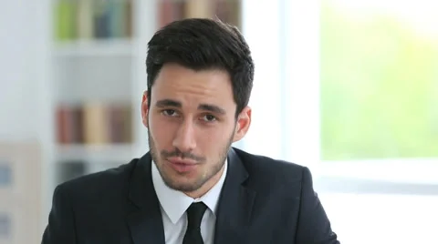 Young businessman talking to camera Stock-Footage 37859339