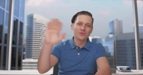 Young businessman talking to web camera in office Stock Footage 134894678