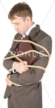 Young businessman tied with ropes Stock Photos