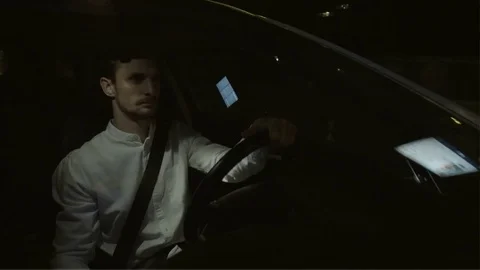 Young Businessman Turning Face Left and Stopping his Car Stock Footage 78641987