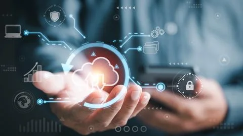 A young businessman uses cloud networking technology to communicate and con.. Stock Photos
