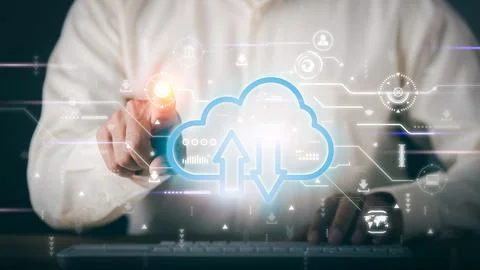 A young businessman uses cloud networking technology to communicate and con.. Stock Photos