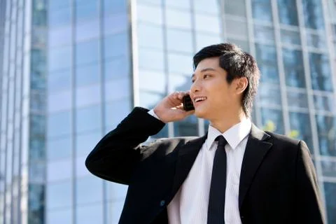 Young businessman using cellphone Stock Photos