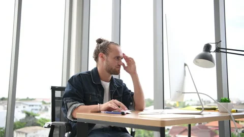 Young Businessman using computer and analysing. Stock Footage 141979219