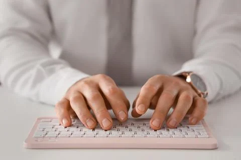 Young businessman using computer to search online at desk in office, closeup Stock Photos