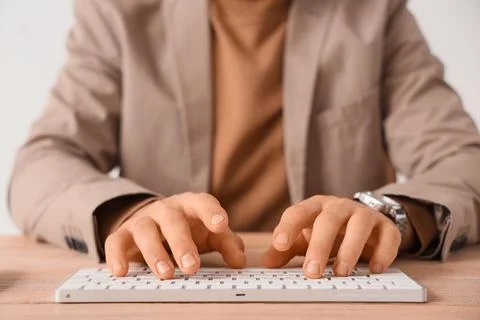 Young businessman using computer to search online in office, closeup Stock Photos