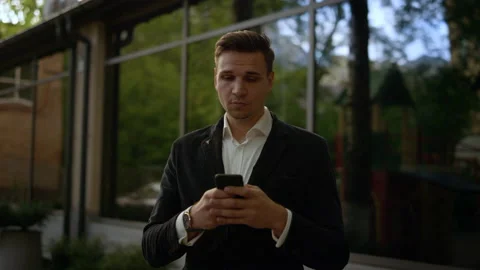 Young businessman using helpful mobile apps for business time management Stock Footage 131602662