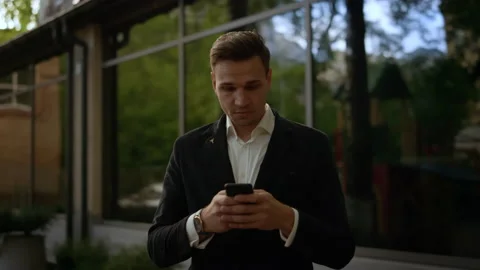 Young businessman using helpful mobile apps for business time management Video stock 141263276