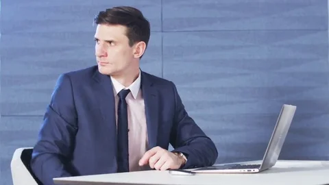 Young businessman using his mobile phone Stock Footage 69212956