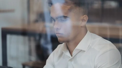 Young businessman using laptop computer at cozy coffee. Successful people, daily Video stock 126712112