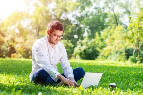 Young businessman using laptop computer Stock Photos