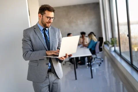 Young businessman using laptop computer in office. Manager thinks about suc.. Foto stock