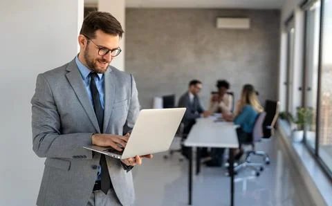 Young businessman using laptop computer in office. Manager thinks about suc.. Stock-Fotos