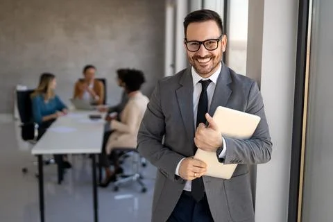 Young businessman using laptop computer in office. Manager thinks about suc.. Stock Photos