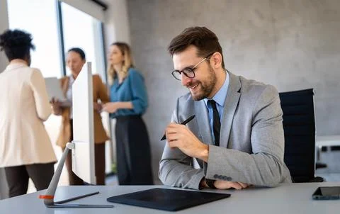 Young businessman using laptop computer in office. Manager thinks about suc.. Fotos Stock