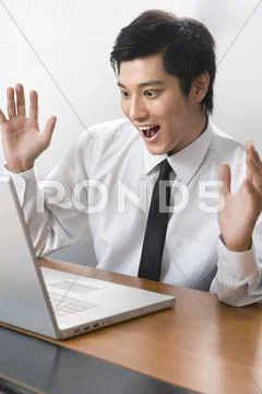 Young businessman using laptop Stock Photos