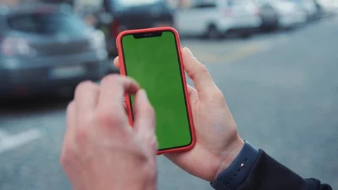 Young businessman using a modern smartphone tapping on screen reading news Stock Footage 113323353