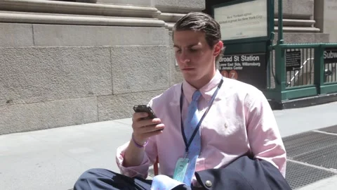 Young Businessman Using Smartphone Outdoors in City Stock Footage 341324068