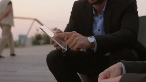 Young businessman using tablet and sharing information with business partner Vídeo Stock 76049860
