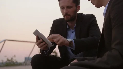 Young businessman using a tablet and sharing information. Video stock 76050277