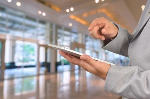 Young Businessman using tablet standing Stock Photos