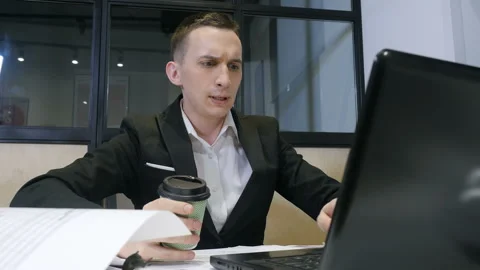 Young businessman at work. A manager working on laptop Stock-Footage 105790236